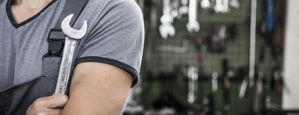 Mechanic posing with a tool