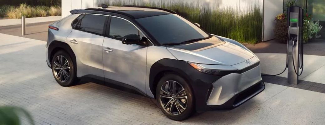 A 2023 Toyota bZ4X being charged at a home station